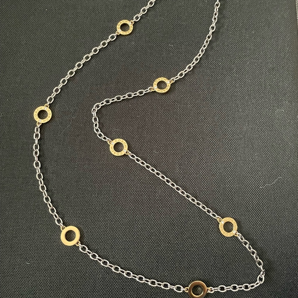Beautiful Coach Silver link with gold circles necklace. About 30 inches long.